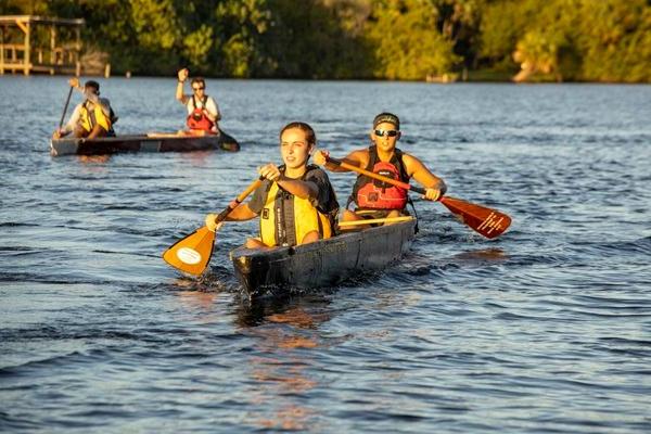 Students paddling concrete canoes they made as part of an ASCE competition