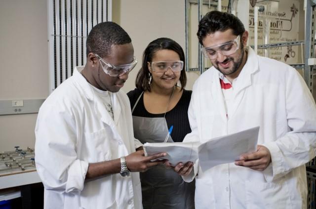 Three students in a chemistry lab