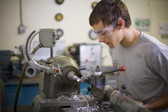 A student working with steel