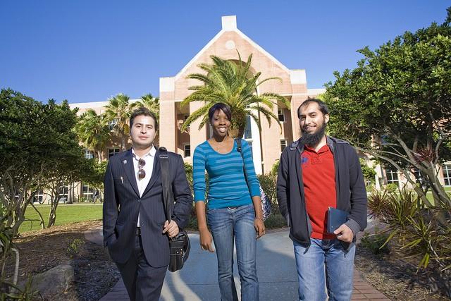 Three students standing outside