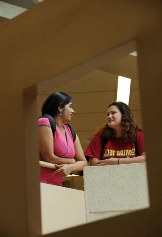 Two students talking inside