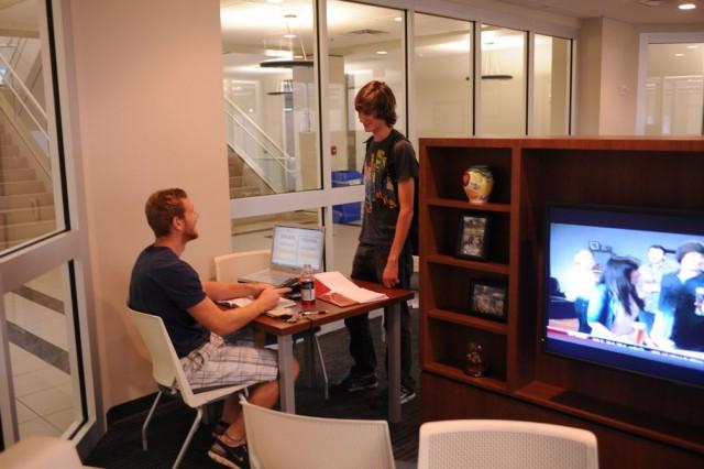 Two students talking in the lobby