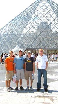 Group of students standing in front of the Louvre